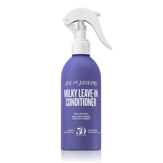 Purple bottle of Sol de Janeiro Milky Leave-In Conditioner with white spray nozzle on a white background