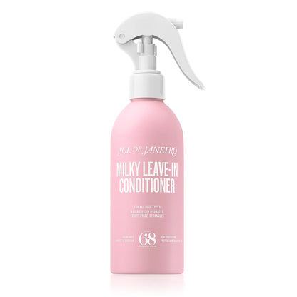 Pink bottle of Milky Leave-In Conditioner with white spray nozzle on a white background